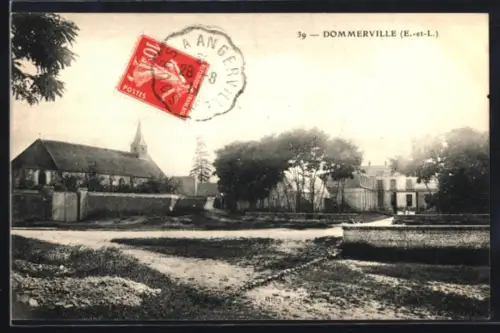 AK Dommerville /E.-et-L., Strassenpartie mit Kirche