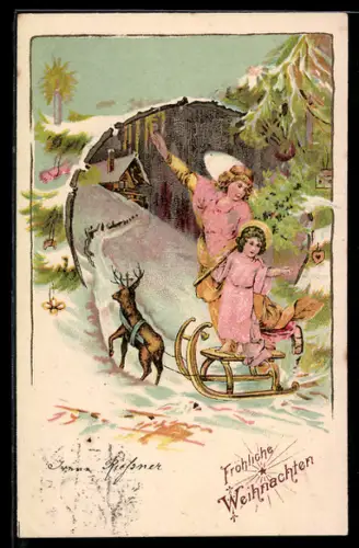 AK Weihnachtsengel mit Aureole auf dem Weg in einen verschneiten Ort