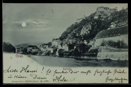 Mondschein-AK Graz, Uferpartie an der Mur mit Schlossberg und Seilbahn