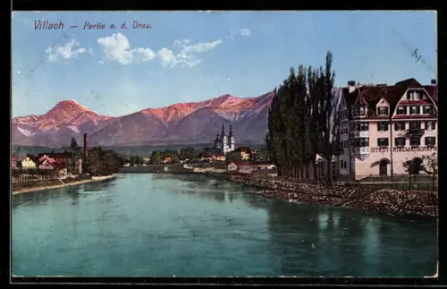 AK Villach a. d. Drau, Partie mit Uferbauten und Kirche