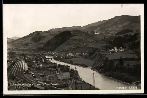 AK Schwarzach im Pongau, Panorama mit Fluss und Bahnanlagen