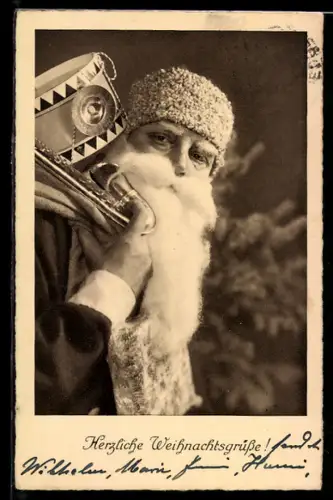 AK Weihnachtsmann überbringt herzliche Weihnachtsgrüsse