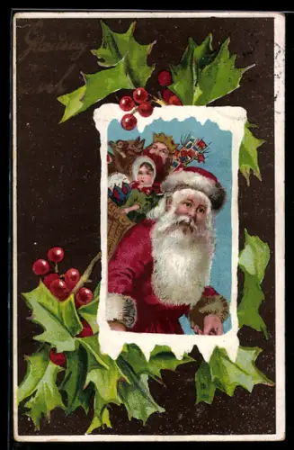 AK Weihnachtsmann mit einem Korb voller Geschenke und Stechpalmenzweigen im Passepartout