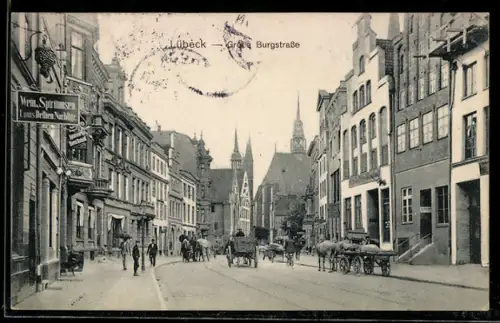 AK Lübeck, Grosse Burgstrasse mit Geschäften, Pferdegespanne