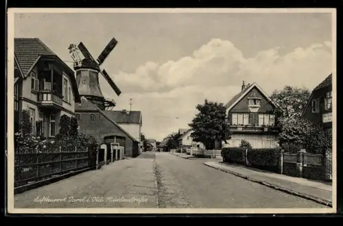 AK Varel i. Old., Mühlenstrasse mit Windmühle