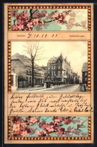 Grusskarten-AK Uelzen, Partie in der Bahnhofstrasse mit rosafarbenen Blumen im Passepartout