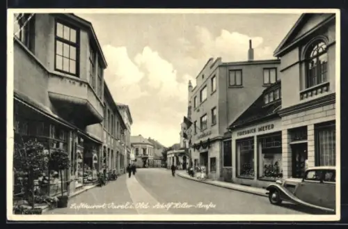 AK Varel, Strasse mit Geschäftshäusern