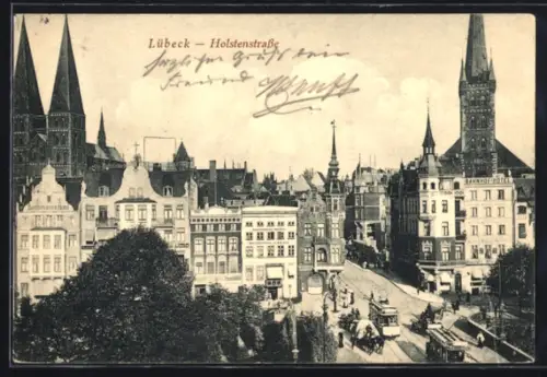 AK Lübeck, Holstenstrasse mit Bahnhofhotel u. Strassenbahn, Kirchtürme