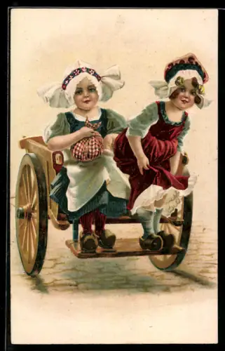 AK Zwei Mädchen in Tracht auf einem Karren