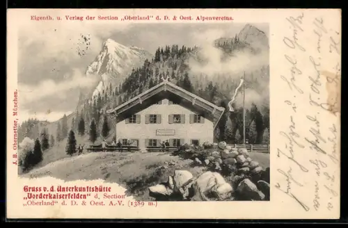 AK Unterkunftshütte Vorderkaiserfelden, Hütte mit Wald und Bergpanorama