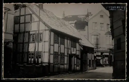 Foto-AK Bünde, Strassenpartie zum Geschäftshaus E.H. Spengemann