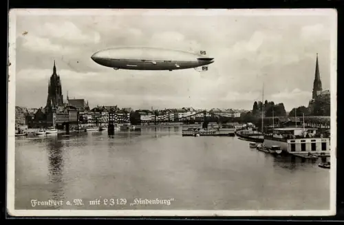 AK Frankfurt a. M., Zeppelin LZ 129 Hindenburg über der Stadt