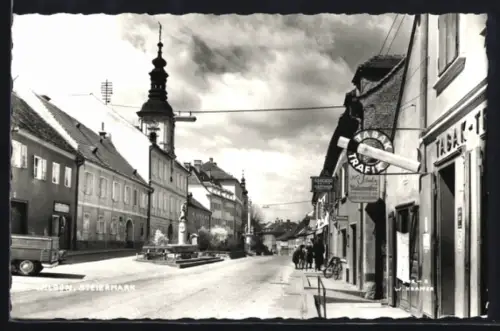 AK Wildon /Steiermark, Strassenpartie mit Kirche und Tabak-Geschäft