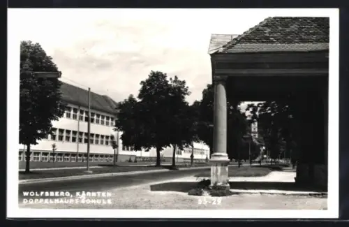 AK Wolfsberg /Kärnten, Doppelhauptschule mit Strassenpartie