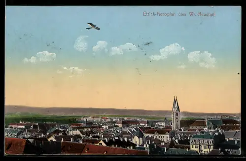 AK Wiener Neustadt, Ortspanorama mit Etrich-Aeroplan und Kirchturm