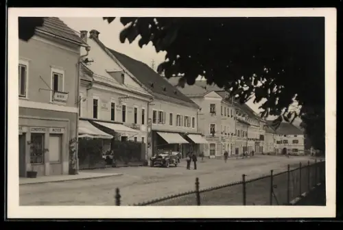 AK Neumarkt /Stmk., Marktplatz, Strassenfront mit Geschäften