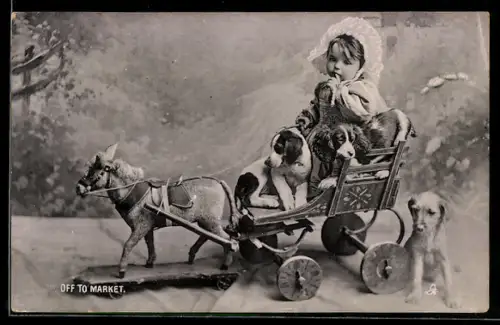 AK Kind auf einer Spielzeugkutsche mit Hundewelpen