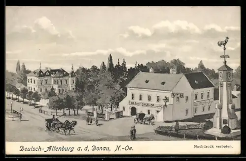 AK Deutsch-Altenburg a. d. Donau, Gasthof zum goldenen Lamm von Franz Klein, Dorfplatz mit Denkmal