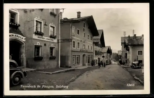 AK Taxenbach im Pinzgau, Strassenpartie mit Gasthof von Z. Örglwirt