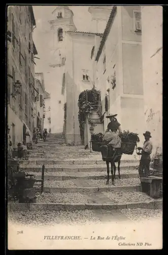 AK Villefranche, La Rue de l`Église avec un âne chargé de paniers
