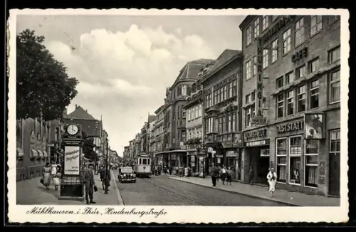 AK Mühlhausen i. Thür., Hindenburgstrasse mit Thuringia Lichtspielhaus, Geschäften und Strassenbahn