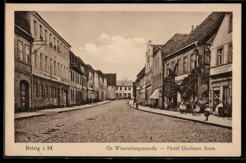 AK Belzig, Grosse Wiesenburgerstrasse mit Hotel Goldener Stern
