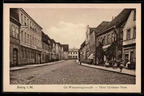AK Belzig, Grosse Wiesenburgerstrasse mit Hotel Goldener Stern