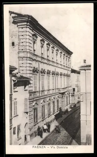 AK Faenza, Via Domizia con edificio storico e passanti sul marciapiede