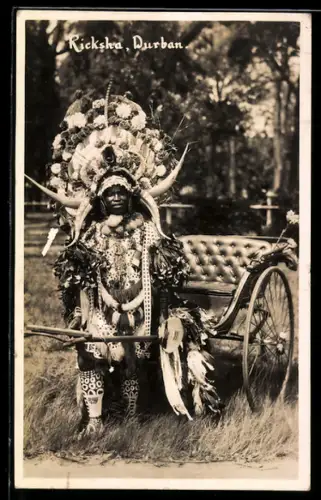 AK Durban, Junge Rikscha in pompösen Trachten