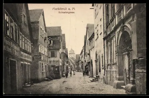AK Marktbreit a. M., Schustergasse mit Geschäften u. Turm, Strassenpartie
