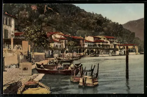 AK Peschiera /Lago d`Iseo, Vista sul lungolago con barche attraccate e edifici storici