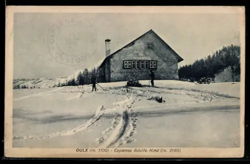 AK Oulx, Capanna Adolfo Kind innevata con sciatori in primo piano