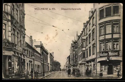 AK Mülheim a. Rh., Blick in die Düsseldorferstrasse mit Geschäft von Gustav Heuser