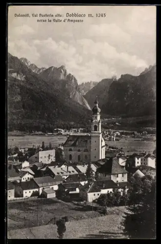 AK Dobbiaco, Vista verso la Valle d`Ampezzo con chiesa e Dolomiti sullo sfondo