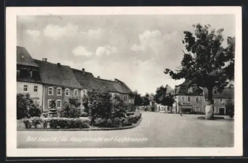 AK Bad Lausick /Sa., Hauptstrasse mit Fischbrunnen
