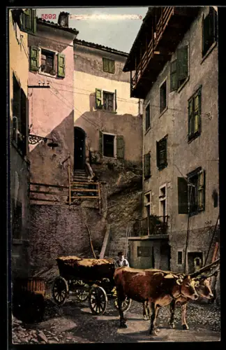 AK Torbole /Lago di Garda, Scena rurale con carri trainati da buoi in una strada di paese