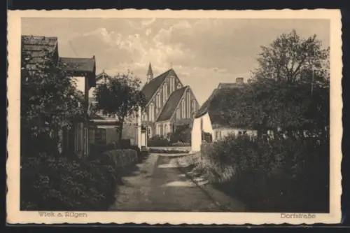 AK Wiek a. Rügen, Dorfstrasse mit Kirche