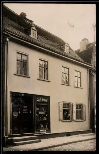 Foto-AK Usingen, Geschäft von Carl Heller mit Maggi-Emailleschild