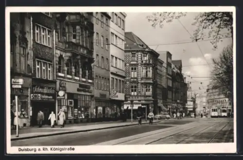 AK Duisburg a. Rh., Königstrasse, Strassenzug, Geschäfte, Strassenbahn