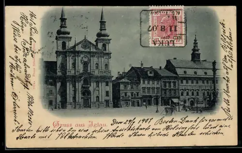 AK Iglau, Kirche mit Denkmal und Geschäften bei Nacht