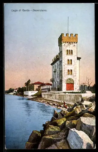 AK Desenzano /Lago di Garda, Torre sul lago con rocce e vista al tramonto