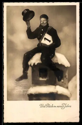 AK Schornsteinfeger sitzt auf einem Schornstein