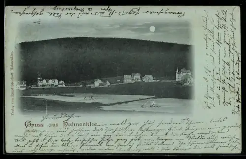 Mondschein-AK Hahnenklee, Ortsansicht vor bewaldetem Berg