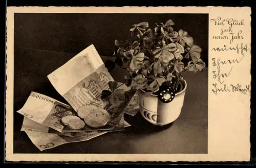 AK 50- und 20-Reichsmarkscheine und Klee im Blumentopf