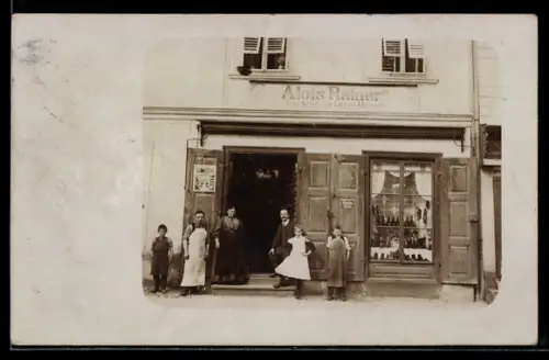 Foto-AK Voitsberg, Geschäft von Alois Rainer in der Aussenansicht