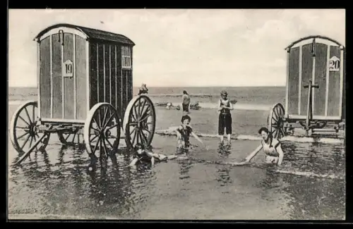 AK Norderney, Damen und Herr in Badeanzügen zwischen Badewagen im flachen Wasser