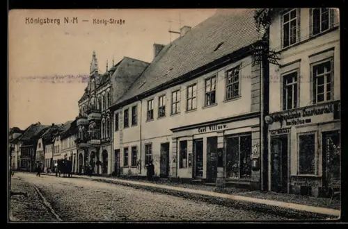 AK Königsberg N.-M, Partie in der König-Strasse mit Geschäft von Carl Villnow