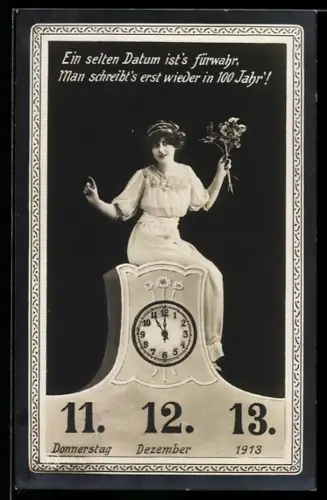 AK Datum 11.12.13, Frau sitzt auf einer Uhr