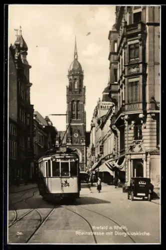 AK Krefeld a. Rhein, Rheinstrasse mit Dionysiuskirche und Strassenbahn