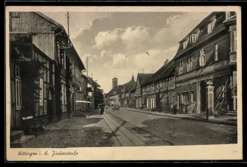 AK Wittingen i. H., Junkerstrasse, Strassenansicht mit Fachwerkhäusern und Kirchturm